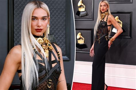 Dua Lipa in Iconic Versace Bondage Dress at 2022 .